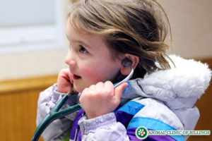 child pretending to be a doctor